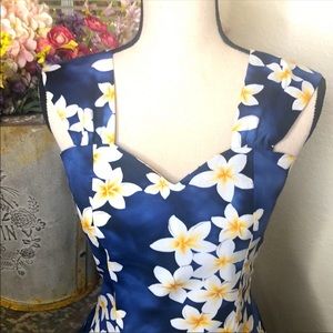 Darling blue cotton sundress with white and yellow tropical flowers.